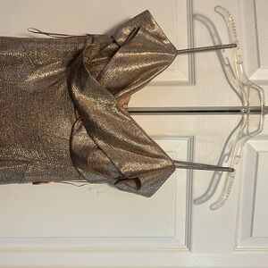 Copper shiny dress with bottom slit.